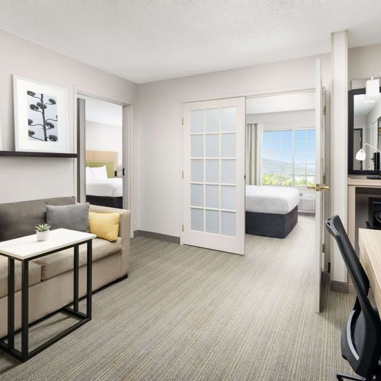 Living room view of Country Inn & Suites by Radisson, Big Flats, NY