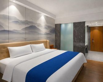 Jingtai Lidu Hotel - גואנגג'ואו - חדר שינה