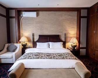 Rongchen International Holiday Hotel - Zhangjiakou - Bedroom