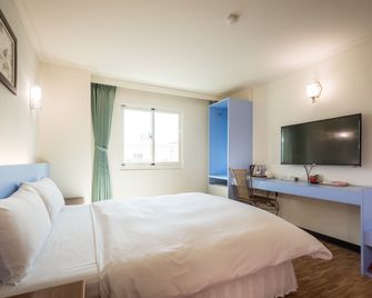 Apple Hotel - Taitung - Schlafzimmer