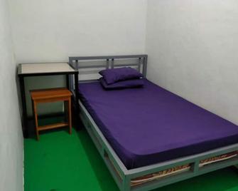 G Land Backpacker - Banyuwangi - Bedroom