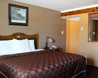 Executive Inn and Suites - Goliad - Schlafzimmer