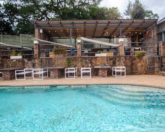 Room 1 of 8 Cozy Suites The Hilltop Guesthouse - Harare - Pool