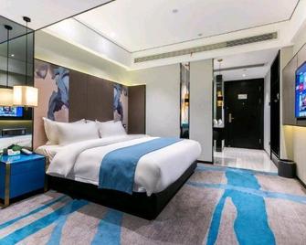 Plato Hotel (Ganzhou Station Branch) - Ganzhou - Спальня