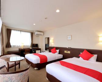 Business Hotel Kukita - Kagoshima - Schlafzimmer