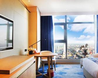 Ramada Plaza by Wyndham Dongxing City Center - Fangchenggang - Bedroom