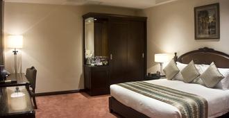 タン パレス ホテル - アクラ - 寝室