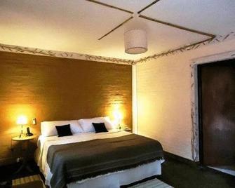 Passaros Suite Hotel - פוארטו איגואזו - חדר שינה