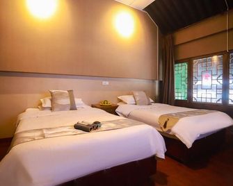 Guangxu Xinggong Inn - Jinzhong - Bedroom