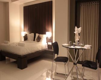 Hotel Magnum Inn - Jūnāgadh - Bedroom