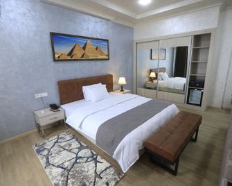 Chlnor Hotel - Andizhan - Bedroom