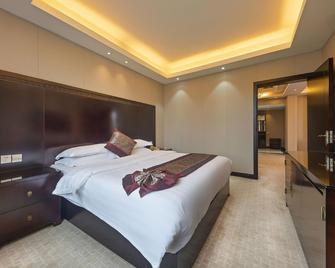 Wuyuan Ruiyi Xingjiangwan Holiday Hotel (Zhuzi Pedestrian Street) - Shangrao - Bedroom