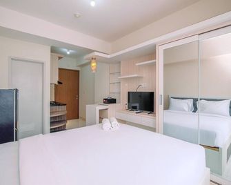 Well Designed and Comfy Studio at Podomoro Golf View Apartment - Tapos - Habitación
