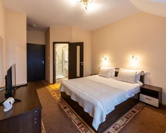 Pension Master - סינאיה - חדר שינה