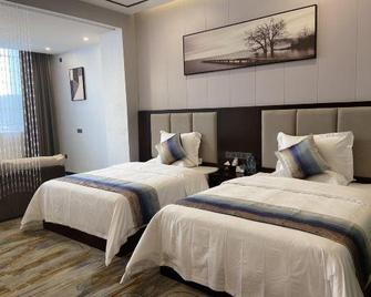 Longcheng Business Hotel - Wenshan - Habitación