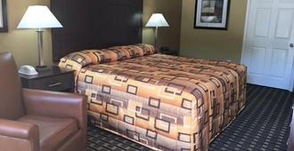 Executive Inn & Suites - Longview - Yatak Odası