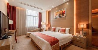 Golden Phoenix Hotel - Taizhou - Schlafzimmer