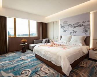 Dragon City International Hotel - Che-jüan - Ložnice