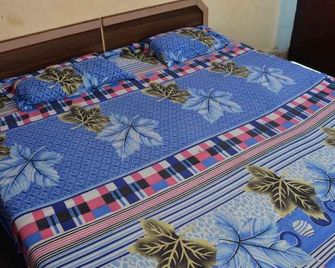 Om Guest House - ורנאסי - חדר שינה