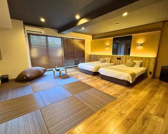Livemax Resort Sanuki Shionoe Onsen - Такамацу - Спальня