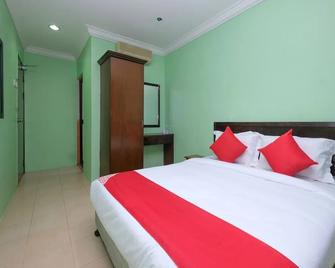 OYO 89759 Gold Jerantut Hotel - Jerantut - Спальня