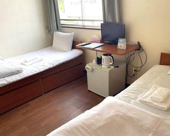 Very popular hotel for sightseeing in Okinawa Arena Free parking no overnight stayTwin room / Nakagami-gun Okinawa - Kitanakagusuku - Slaapkamer