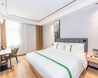Greentree Inn Qingdao Licang Shuyan Road Daweng Square Express Hotel - צ'ינגדאו - חדר שינה