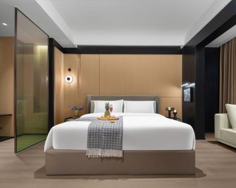Xingting Hotel (Hejiangmen Square Yangtze River Park Water Curtain Plaza Branch) - Yibin - Bedroom