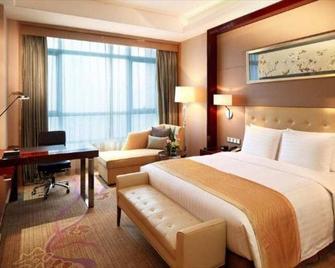 Greentree Inn Shandong Jining Weishan Lake National Wetland Park Business Hotel - Zaozhuang - Спальня
