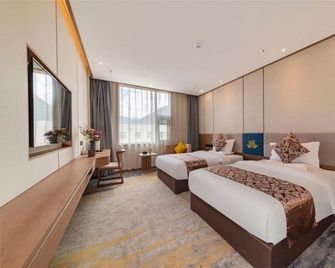 Nyingchi Impression Hotel - Ньїнгчі - Спальня