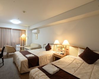 Sunwest Hotel Sasebo - Sasebo - Schlafzimmer