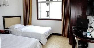 Enshi Liyuan Hotel - Enshi - Bedroom