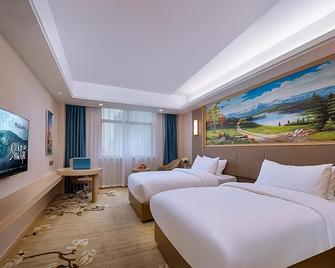 Vienna Hotel Shandong Zaozhuang Tengzhou Railway Station - Zaozhuang - Bedroom