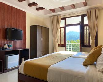 Hotel Nirvana Palace - רישיקש - חדר שינה