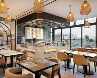 Hotel Local Dubai, Jumeirah Village Triangle, Autograph Collection - Dubái - Restaurante