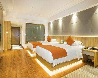 Longquan Hotel (Haikou Qilou Old Street Branch Youyi Commercial Plaza Branch) - Haikou - Bedroom