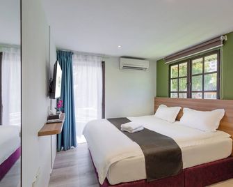 Gaia Hotel - Tanjung Bungah - Спальня