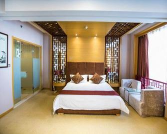 Mudanjiang Kunlun Hotel (Railway Station Pedestrian Street) - Mudanjiang - Camera da letto