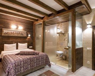 In Stone House - Cavusin - חדר שינה