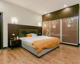 Yijingyuan Hotel - Qiannan - Bedroom