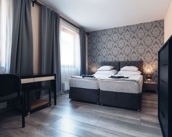 Végvári Hotel Eger - אגר - חדר שינה