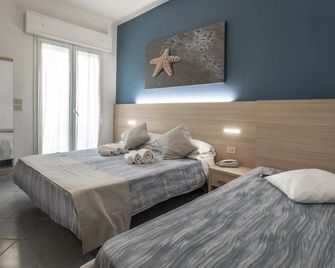 Hotel Esperia - קתוליקה - חדר שינה