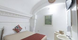 Hotel Colonial - Mayagüez - Schlafzimmer