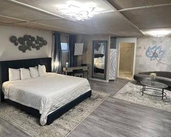 Square Inn - Wimberley - Schlafzimmer
