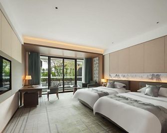 Ronghu Hotel - גילין - חדר שינה