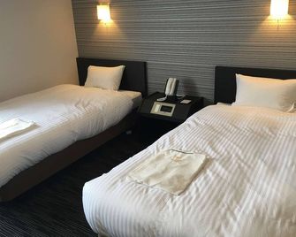 Hotel Paradise Inn Saza Inter - Сасебо - Спальня