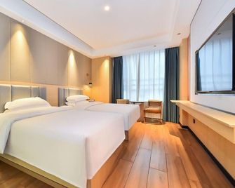 Meiqi Holiday Hotel (Guiyang Baiyun North High-Speed Rail Station, Liyang Branch) - Guiyang - Schlafzimmer