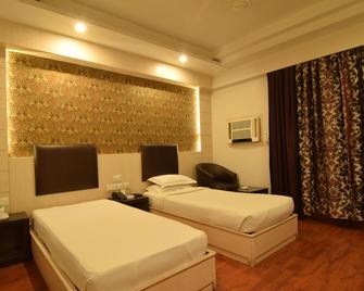 Hotel The Sojourn - Kolkata - Bedroom