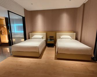 Yuxian Zixuan International Hotel - Yangquan - Спальня