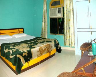 Bhandari Swiss Cottage - רישיקש - חדר שינה